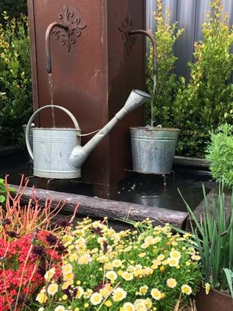 Gardening themed water feature by Clint Kenny Design